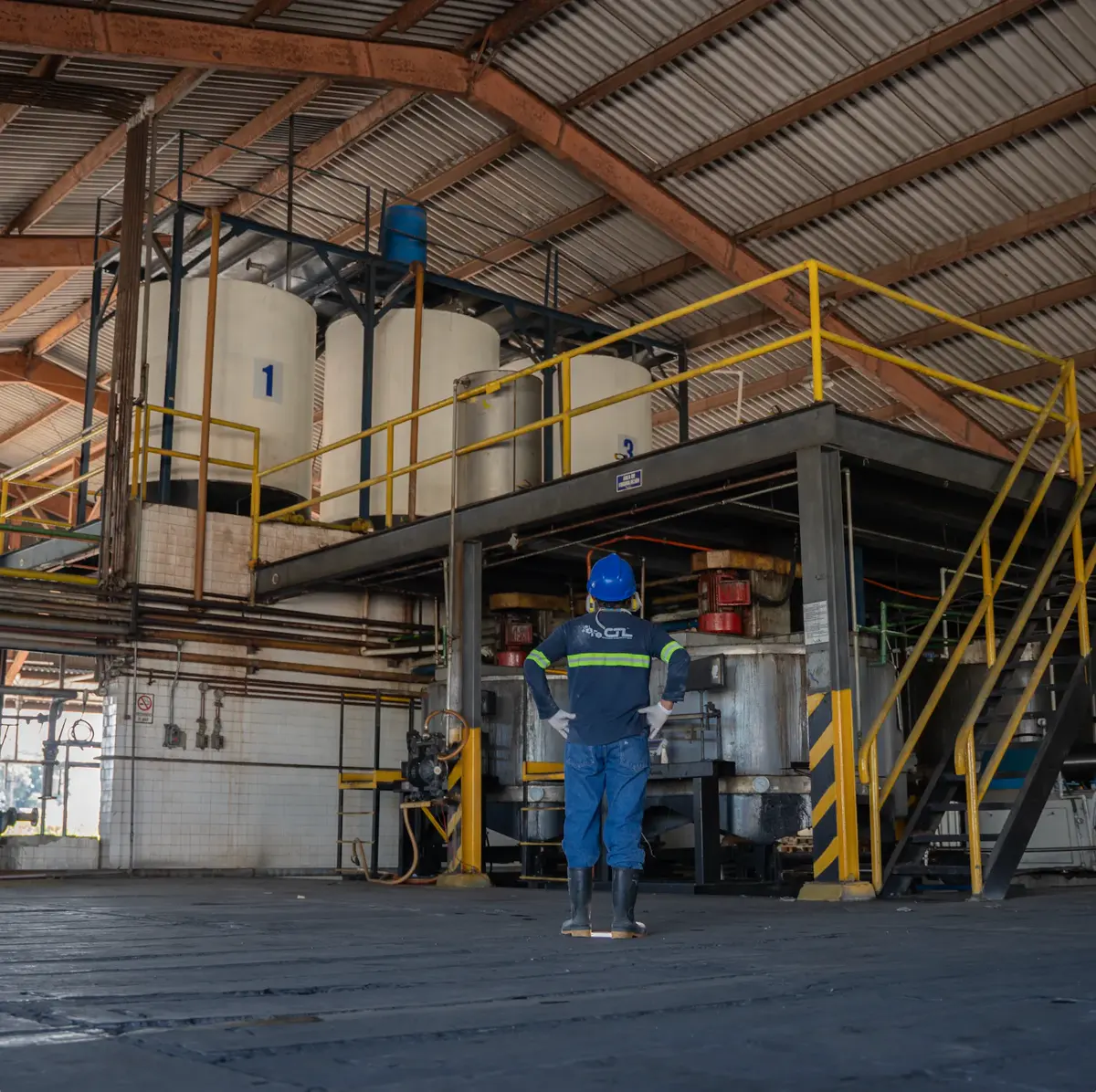 CTL operator in front of formulation tanks at the industrial plant