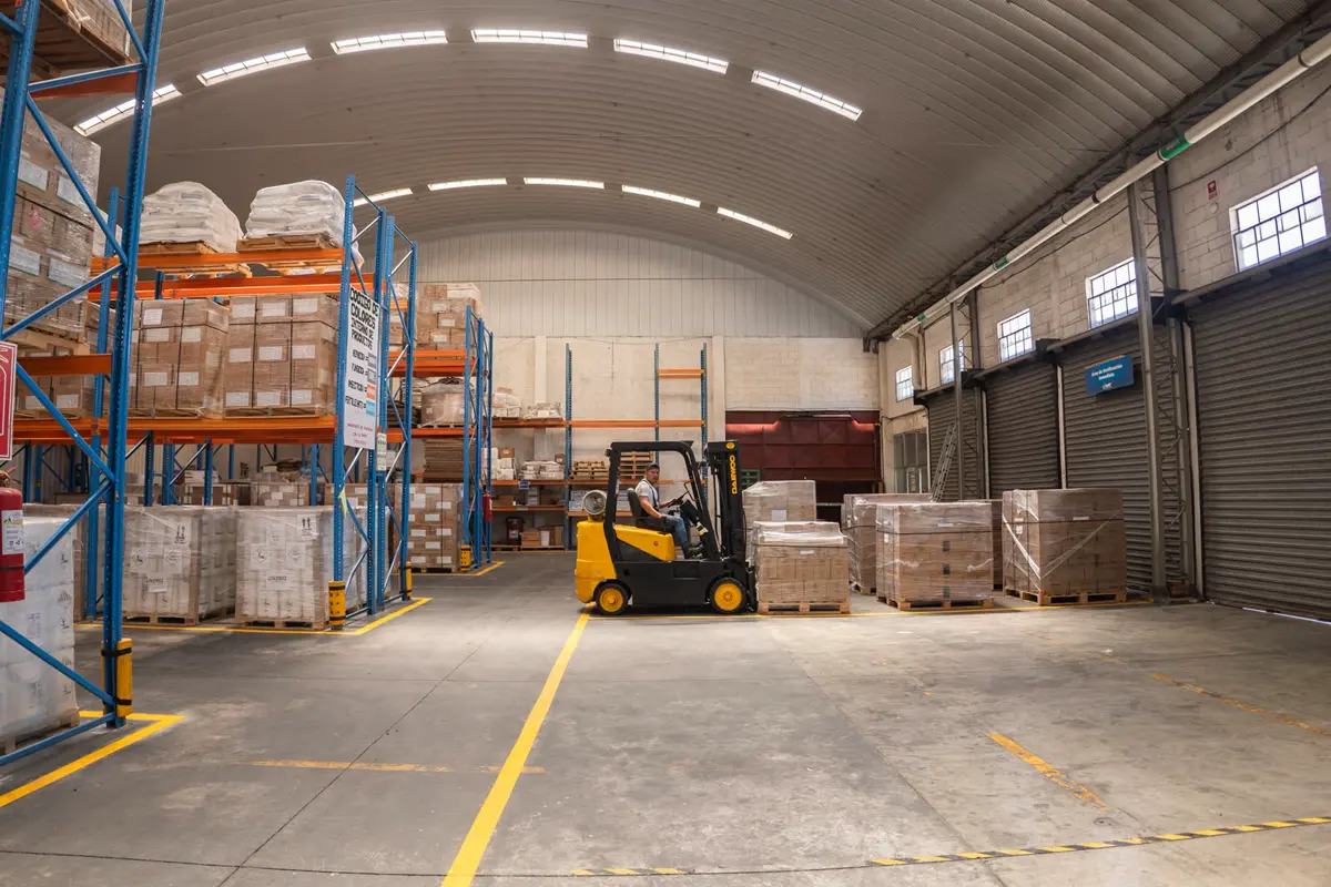 Forklift and pallets in the CTL storage warehouse